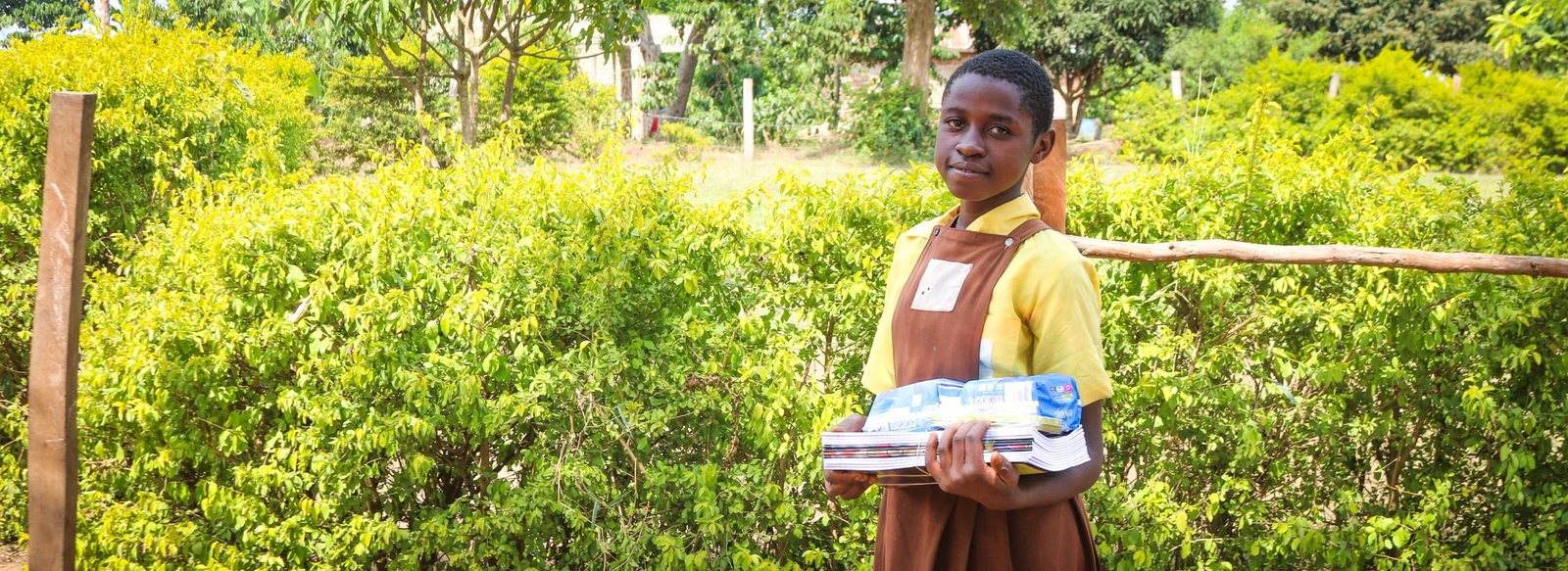 Grace walking to school in rural Uganda