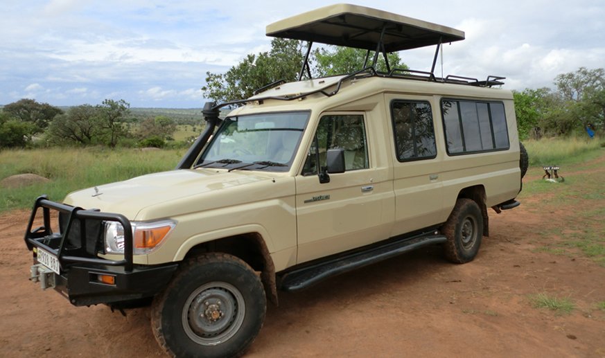 Toyota Land Cruiser 4x4 rental Uganda with pop-up roof for safari game viewing
